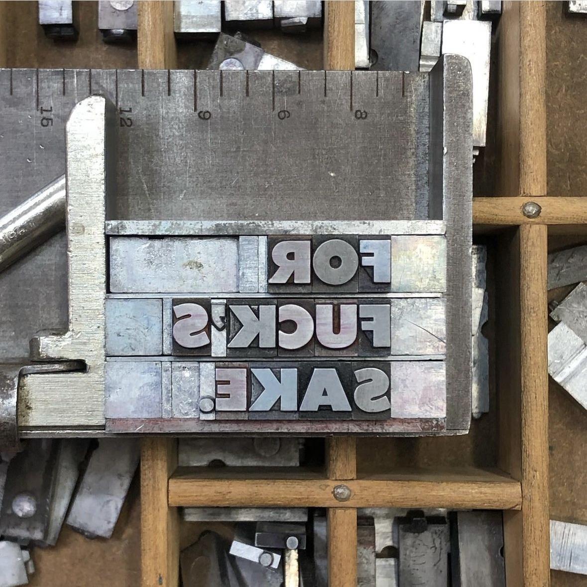 Metal type ready to be pressed