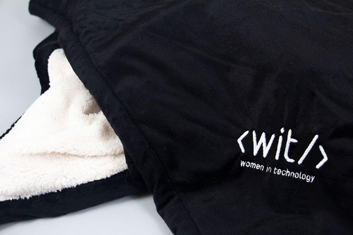 A WIT-branded blanket